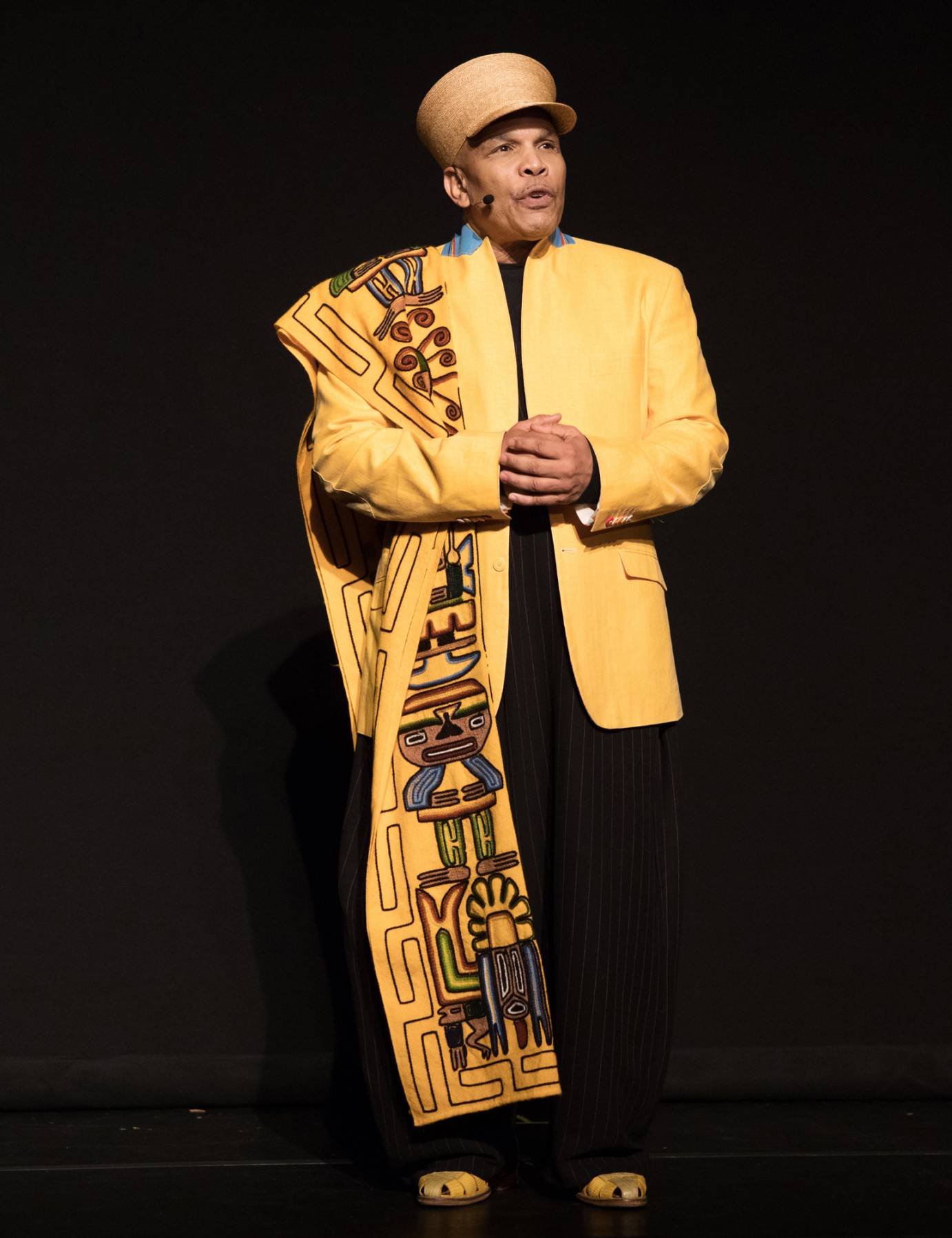 Abdel Salaam in a hat and beautiful yellow embroidered coat